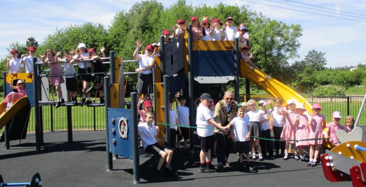 Mayor Cllr John Sewell (centre) leads the official opening of the new Larklands play equipment