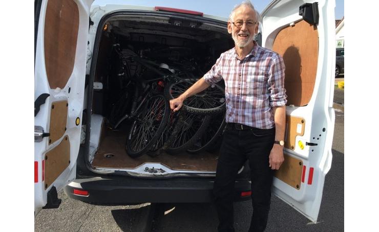 Pete Wearn with some of the 1000 bikes ready for delivery in his trusty white van