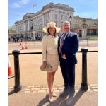 John Collins with his wife Ms Stephanie Meadows at Buckingham Palace
