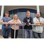 from left: Daniel Ash is pictured (second right) with, from left: support worker Ben Kendall and Games Development teachers Leigh Champion and Nathan Rogers.