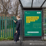 Person waiting at a bus stop with Government ad banner (credit: Igloo PR)