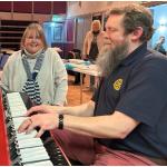 Leon Wade pictured during his 24-hr pianothon as supporters watch on