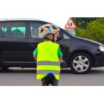 A child riding a bike with a helmet and hi-vis jacket on approaching a car with the driver looking on - credit: Derbyshire PCC's office
