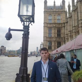 Alec pictured outside the Houses of Parliament