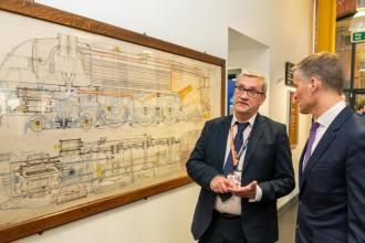 Brian Malyan, Assistant Principal (Technology) explaining the history of the Roundhouse to the Transport Minister Mark Harper. 