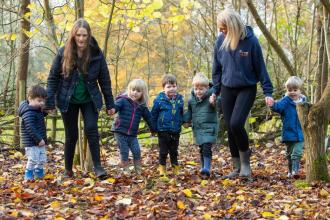 Second (2) - Jennifer Lewis (Early Years Apprentice) and Kate Cox (Nursery Manager) and the children enjoy a woodland walk at Broomfield Hall.