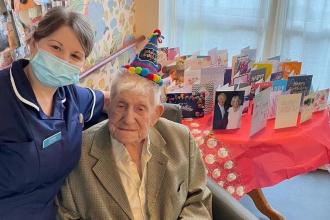Donald Rose with a selection of cards on his 108th birthday