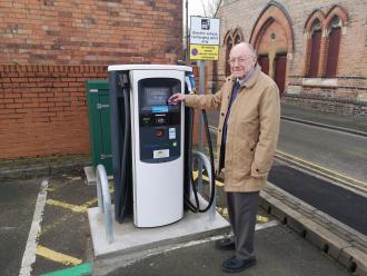 Councillor Michael Powell, Lead Member for Regeneration and Planning, at the new electric vehicle charging bay in the Gibb Street car park in Long Eaton.