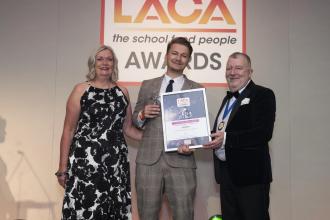 Derbyshire County Council school catering service apprentice Jo Rinkevicius receives his LACA Trainee/Apprentice of the Year Award from LACA National Chair Jacquie Blake and former Chair Stephen Forster.