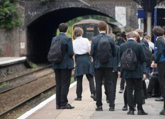 School children waiting the arrival of a Northern service