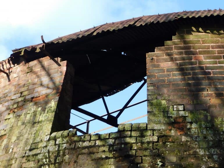 Plans to build homes bordering a widely contaminated historic former Derbyshire industrial site are set for approval. At an Erewash Borough Council meeting next week, councillors are being recommended to approve plans for 82 homes next to the former Oakwell Brickworks, between Ilkeston, Kirk Hallam and Stanton, stemming off Derby Road. If approved, part of the heavily contaminated former brickworks would be built on, but just for a flood water collection pond, not for homes. The Grade-II listed and heavily dilapidated former Hoffman kiln at the centre of the former brickworks site would not be affected. Residents remain concerned about what potential impact the proposed development could have on the hazardous waste deposited on the brickworks site. Meanwhile, experts, including the Mining Remediation Authority, while not objecting, say “intrusive” site investigation works followed by any required remediation, must take place before work starts. Further officials say investigations to date have been “limited in scope” and need to be re-explored in depth. Documents submitted by the developers, Waterville Land Ltd, found “there was a low risk to future residents from any potential on-site and off-site sources of contaminants”. The area which forms part of the former brickworks, which is to be used for a floodwater drainage pond, “was not investigated due to the presence of a sewer and dense vegetation”. It details: “However, no signs of raised ground were observed, and as this area is proposed for public open space this is unlikely to present a significant risk. It is recommended that additional investigation is undertaken once the area has been cleared.” Comments from the borough council’s housing and policy teams list their support for the scheme, utilising land in the Ilkeston urban area and inclusion of 15 per cent affordable housing – 12 two-bed houses. A total of 11 objection letters have been submitted by residents, opposing the potential harm to widespread wildlife and the landscape, road safety issues, increased congestion, lack of infrastructure such as health and school facilities, and concern over contamination and associated health risks. Council officers, recommending approval, said: “Inevitably, the development of this site will result in many changes for those residents who live nearby. The site is currently undeveloped and the development of 82 dwellings will result in physical and visual changes to the area and will result in more noise than has been previously experienced from the site. “However, it is considered that the development has been designed such that the impact arising would not result in unacceptable harm to the residential amenity of surrounding properties. “The applicant has supplemented their initial eight boreholes with a further five along the boundary with the former brick pit. “These found no evidence that the brick pit extended onto this land, no evidence that there is made ground on this land from the brick pit, and no evidence that any contamination associated with the brick pit is leaching onto this development site. “The applicants therefore conclude that they consider the development site to fall in the lowest risk category for contamination.” The developers have committed to providing £162,000 for improvements at Field House Infant School, £153,000 for improvements at Ormiston Ilkeston Enterprise Academy, £82,000 for improvements at nearby healthcare facilities and £5,700 for Ilkeston Library stock. If approved, the breakdown of house sizes would be: 35 two-bed houses, 45 three-bed houses and two four-bed houses. The site’s history stretches back more than 100 years, during which it has been mined for coal, become a dumping site of harmful and toxic materials, seen widespread fly-tipping of asbestos, been a storage space and tip for World War Two bombs – as well as a renowned brickworks. Contamination fears have consistently stalled housing plans on the overall former brickworks, with the borough council having earmarked the site for 519 houses and a further 138 on adjoining plots in 2012. Much of the land was used for the dumping of offshoots from the Stanton Ironworks nearby – the firm had bought the brickworks in 1919 and later merged it fully with its own operations. Ground investigation expert RSK was commissioned to look into the site by owners Tata Steel. It noted that Stanton had filled clay pits on the site with blast furnace and concrete slurry, oil residue, coke grit, ammonia and sulphur building waste including foundry sand, spent lime and asbestos-containing materials. RSK found that the “main contaminant of concern” was lead while there were also “elevated concentrations” of arsenic, cyanide and benzo(a)pyrene (a material found in coal tar and tobacco which causes cancer). It said that asbestos material has also been found in samples and seen on the site from historic and current fly-tipping issues.